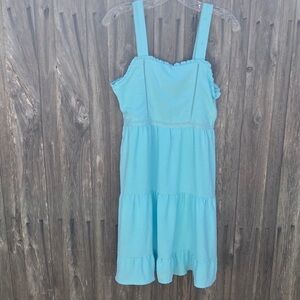 Cute sun dress by Planet Heart light blue size med measurements below Swiss dots